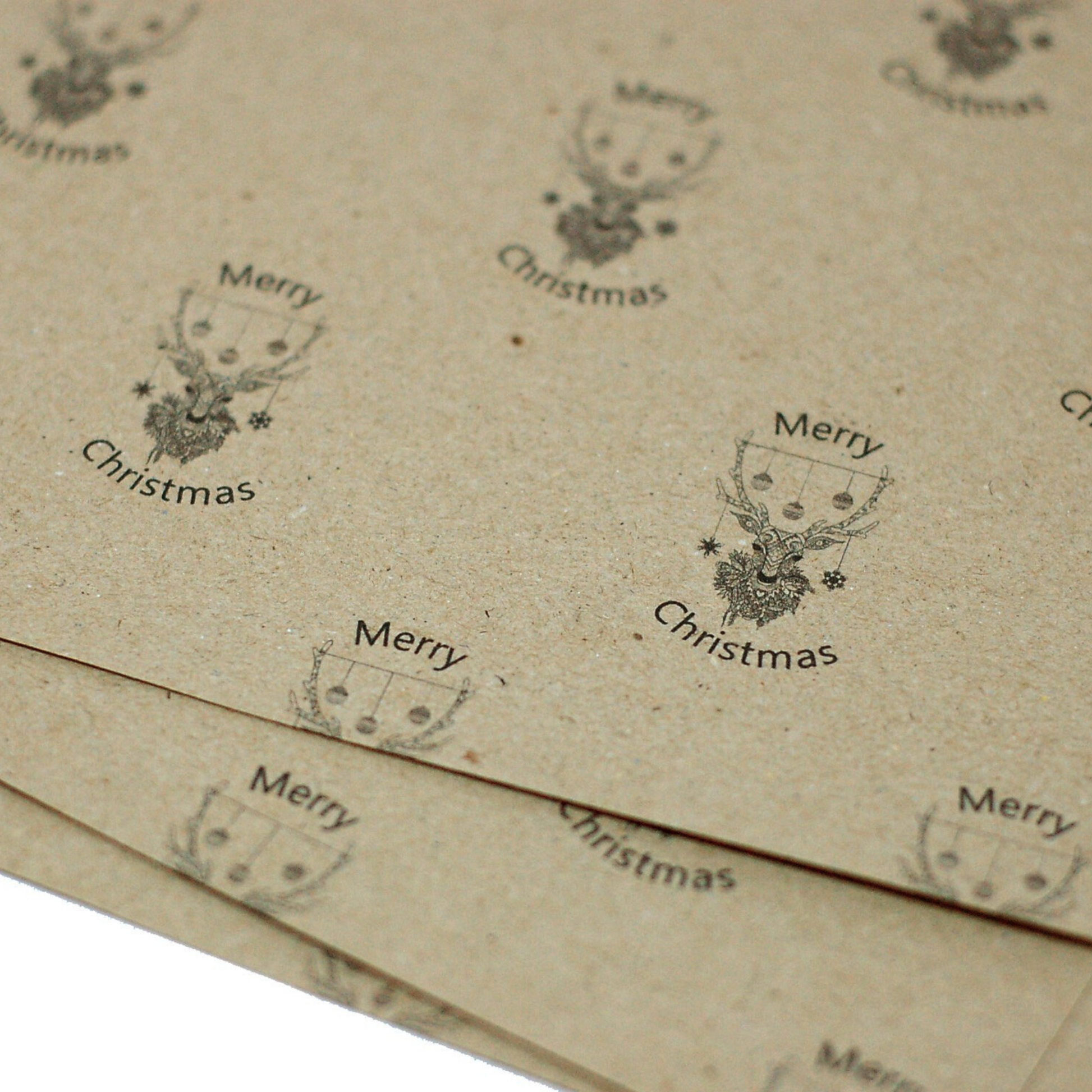 Recycled kraft Paper Christmas Wrapping with Reindeer Head and black baubles