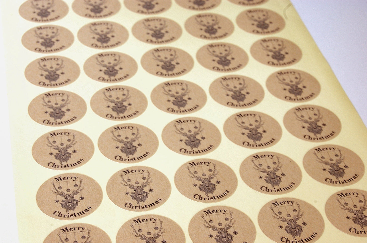 35mm Kraft Christmas Stickers featuring reindeer head