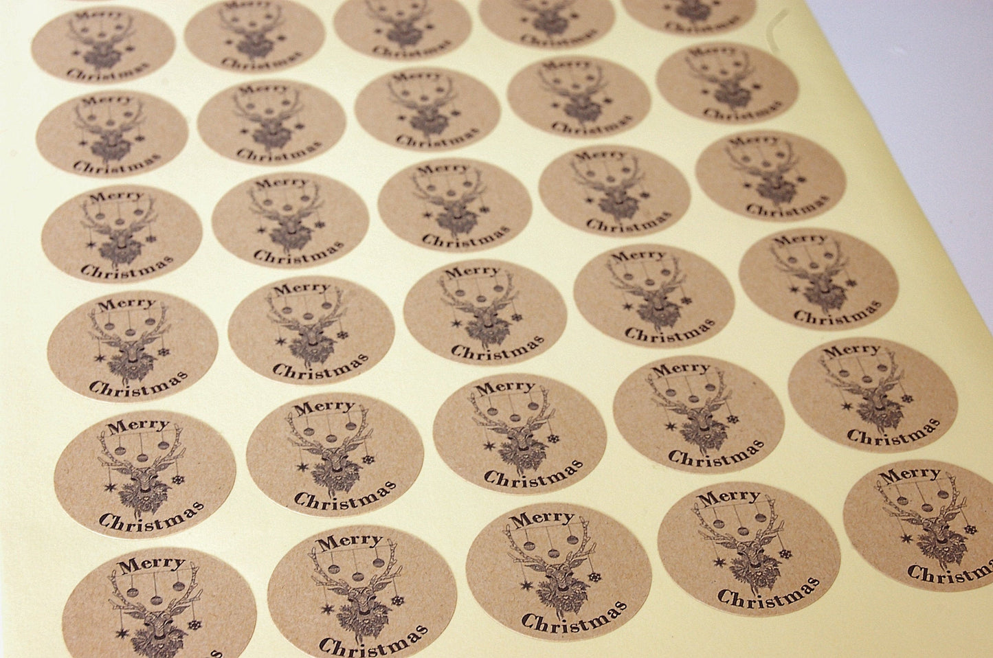 35mm Kraft Christmas Stickers featuring reindeer head